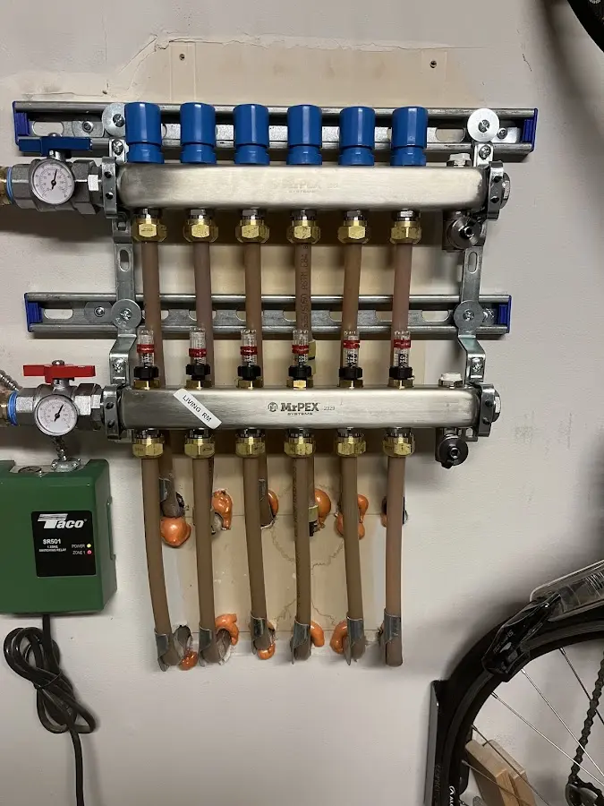 Plumber performing Water Heater Repair at a residential property in Longbranch