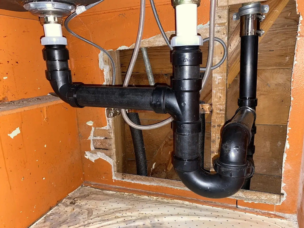 Professional Garbage Disposal Repair equipment and tools on the job in Longbranch